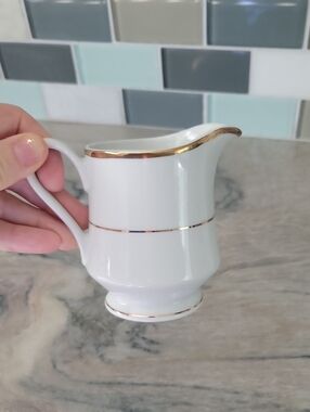 Crescent White Porcelain Creamer with Gold Marking